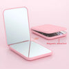 A pink portable LED magnifying makeup mirror with a magnetic attraction feature shown open and closed.