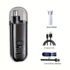 A black electric portable hair and nose trimmer with spare blades, a charging cable, and a cleaning brush.