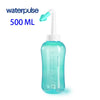 A clear turquoise waterpulse nasal irrigation bottle with a white nozzle and plunger.