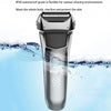 A silver electric shaver is shown submerged in water, highlighting its IPX6 waterproof grade.