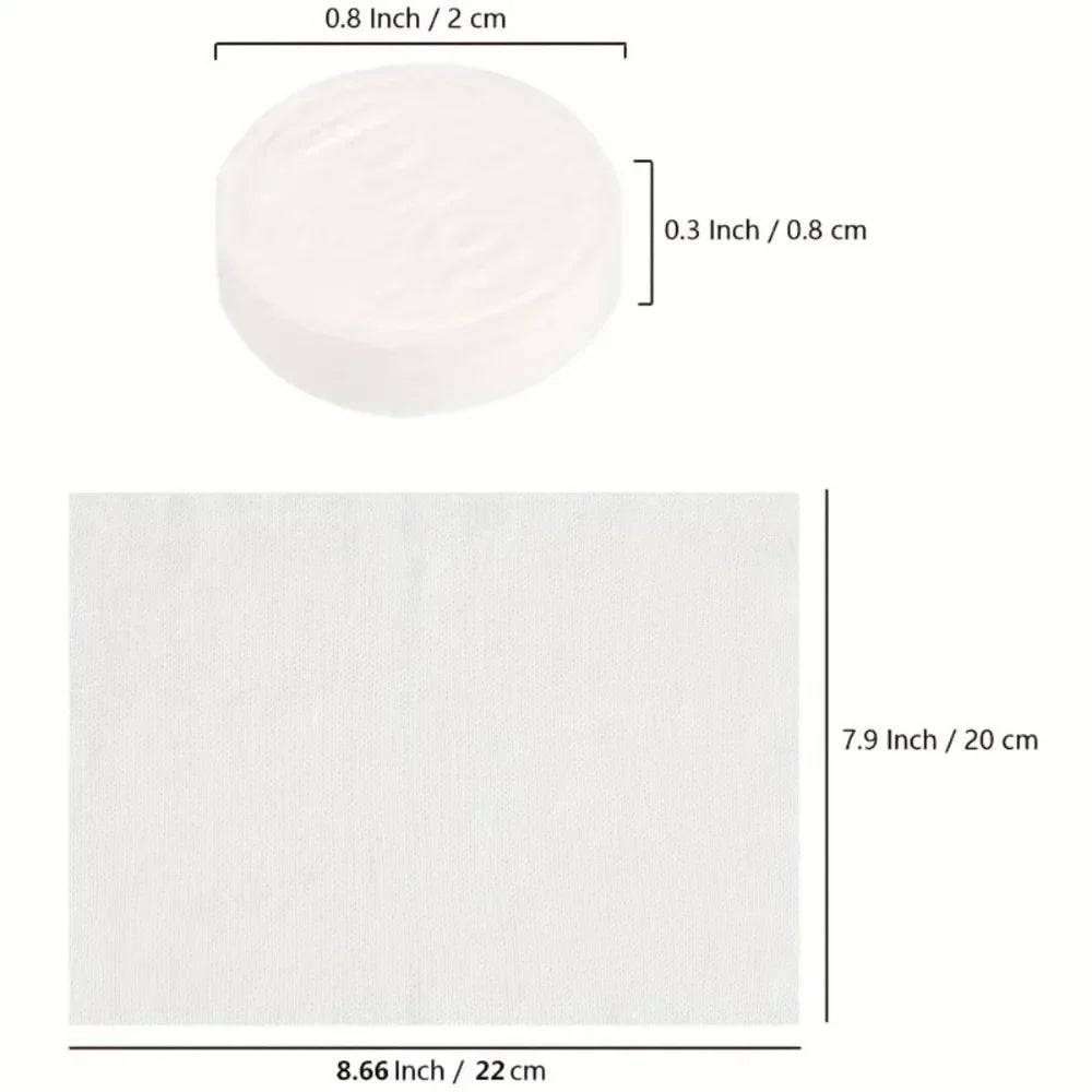A white reusable compressed face towel with dimensions of 0.8 inch by 2 cm.