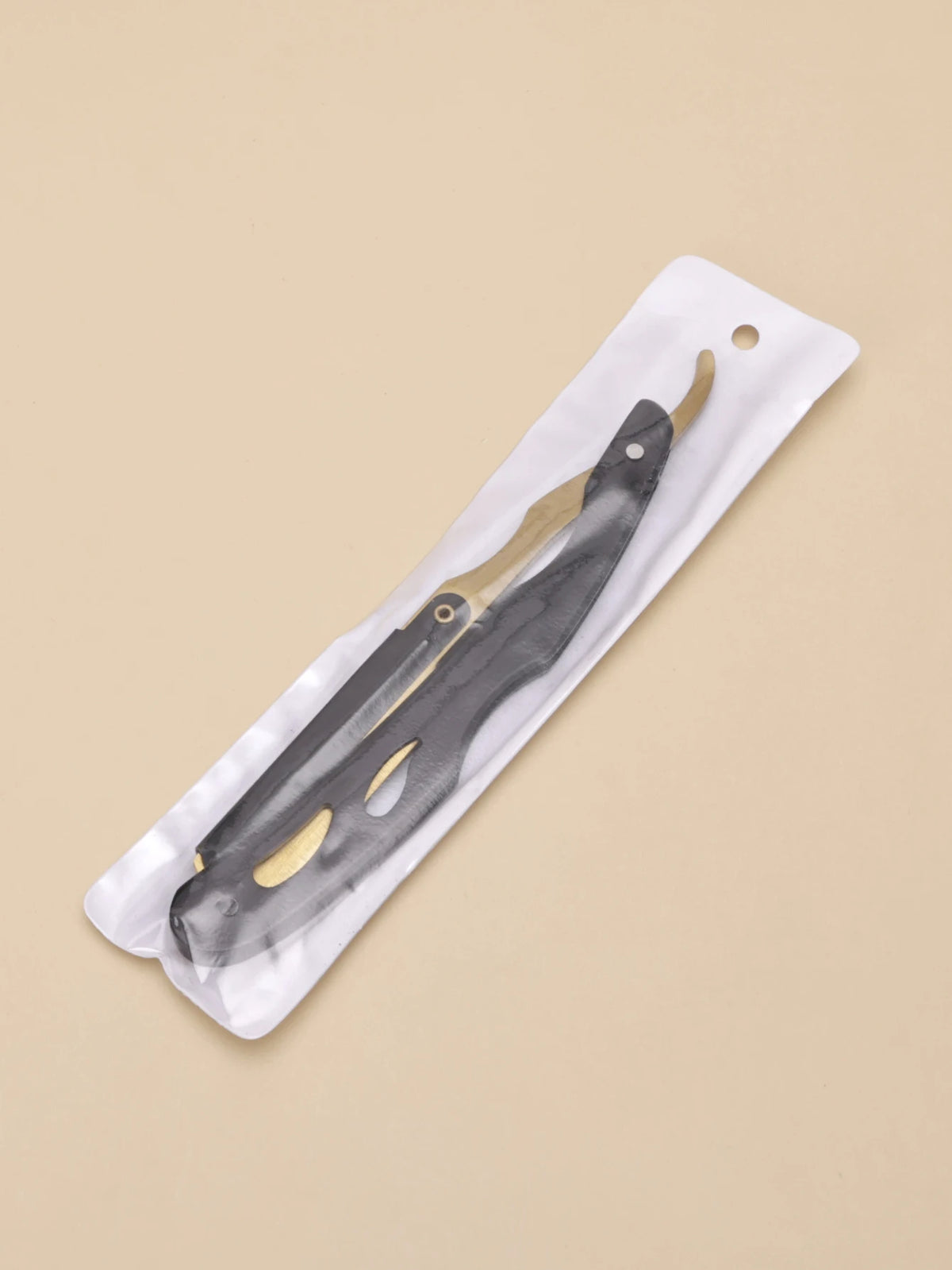 A professional stainless steel shaver and beard razor kit shown on a white cloth background.