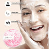 A woman is using a pink foam sponge cleanser on her face, demonstrating its use for removing cosmetic residue and dead skin.
