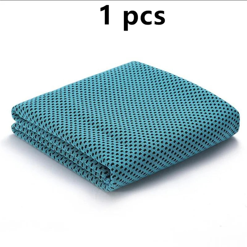 A folded teal patterned sport towel for gym and travel.