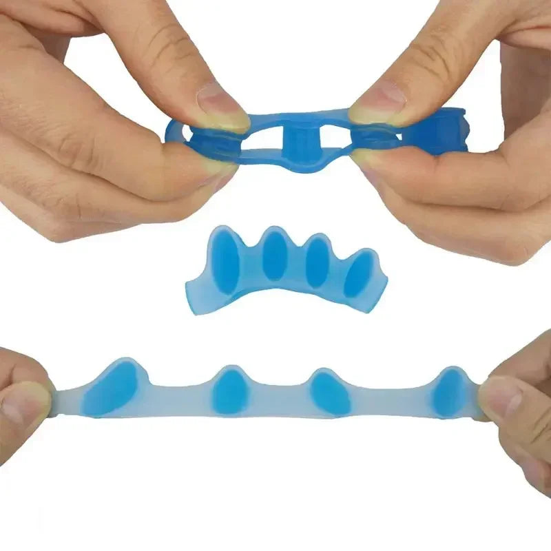 Hands hold soft blue gel toe separators for foot and toe alignment.