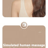 A woman is using a white eye massager device designed for acupressure points on her face.