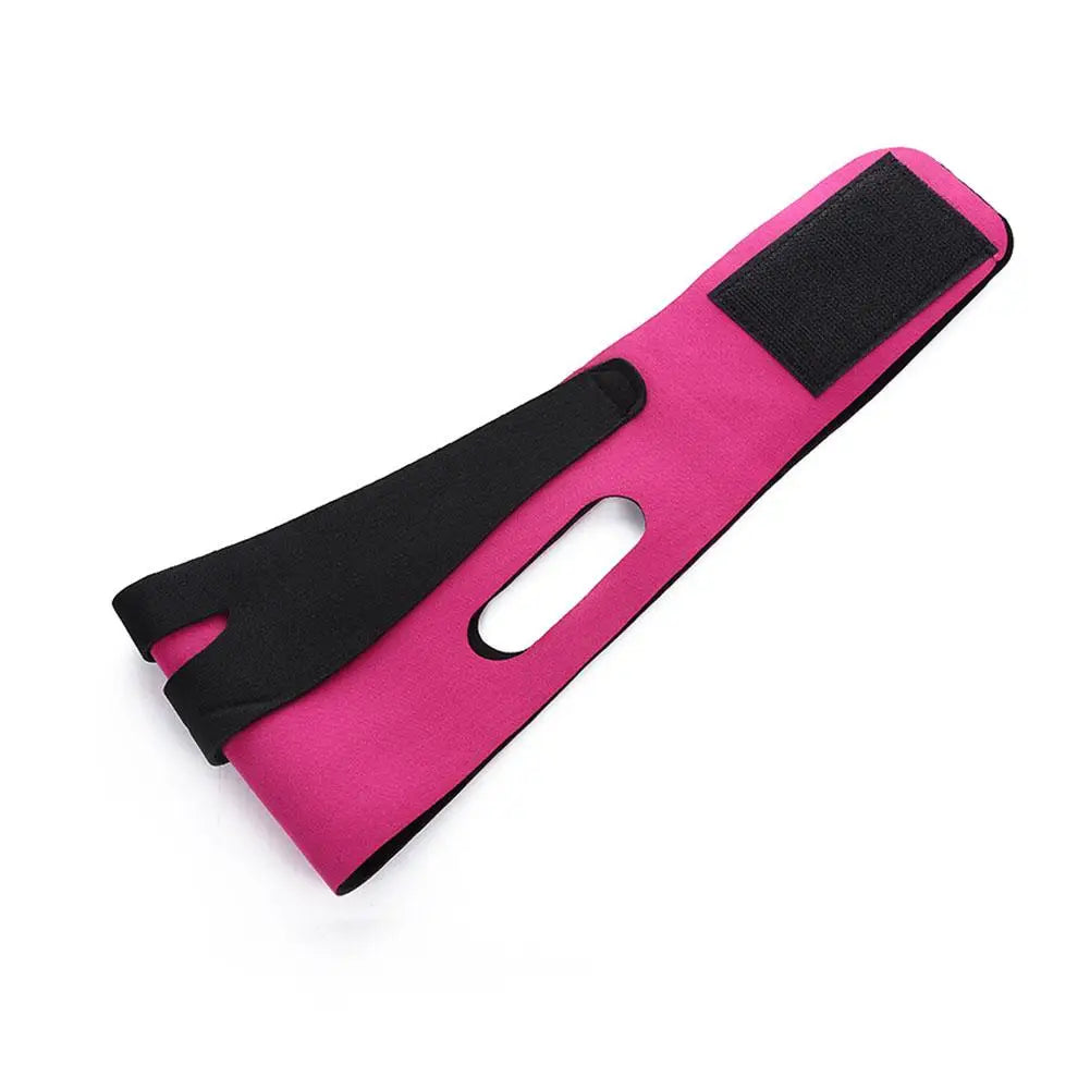 A pink and black strap designed for facial slimming or V-line contouring.