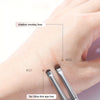 A hand demonstrates the use of a shadow smokey liner brush for an ultra-thin eye line application.