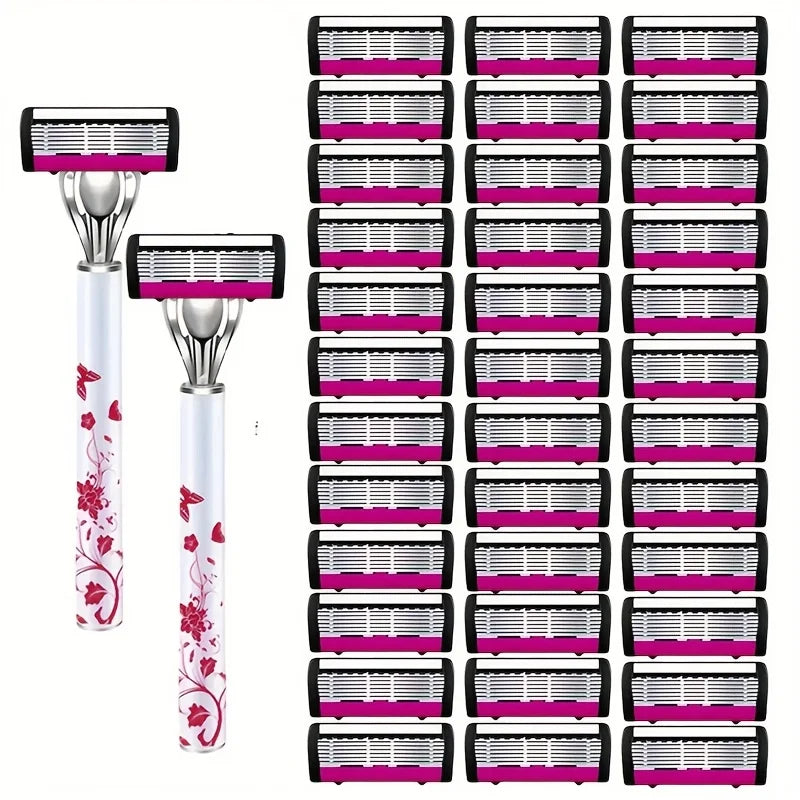 A set of stainless steel multi-layer body hair removal razors in pink and black packaging.