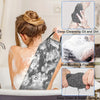 A woman is using a dark exfoliating body scrubber to cleanse her skin in a bathtub, showing the product's texture and foaming