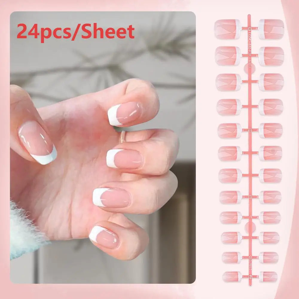 Sheet of 24 press-on nails with nude pink base and white French tips displayed on a hand.