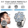 A close-up of a multi-function electric grooming kit with multiple rotating heads and a handle, shown next to a man's face.