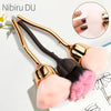 A set of gold and black dust brushes for nail art, featuring soft pink and magenta bristles.