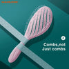 A pink hollow-out detangling hair brush with scalp massage bristles is shown diagonally on a teal background.