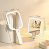 A portable LED square mirror with adjustable light color settings shown on a table.