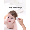 A baby is being groomed with a white electric hair trimmer on their head in a low noise design context.