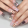 A set of white French style press-on nails featuring various patterns including polka dots, stripes, and silver floral accent