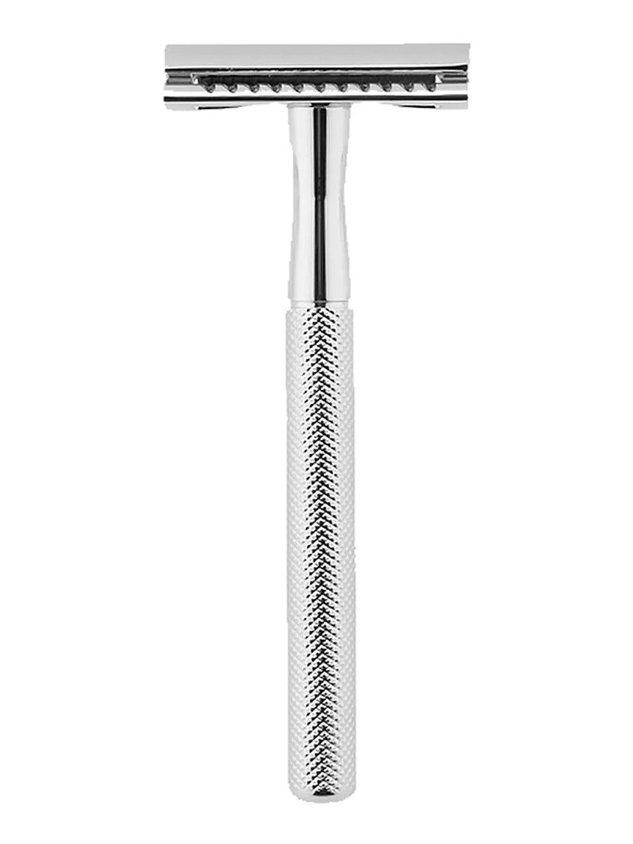 A silver vintage double edge safety razor kit with a metallic handle and blade assembly.