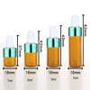 A set of five glass dropper bottles containing essential oils or samples, varying in volume from 1ml to 5ml.