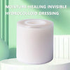 A roll of white moisture-healing hydrocolloid dressing placed on a white surface.