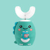 A teal electric toothbrush shaped like a cute, smiling dinosaur with a white brush head.