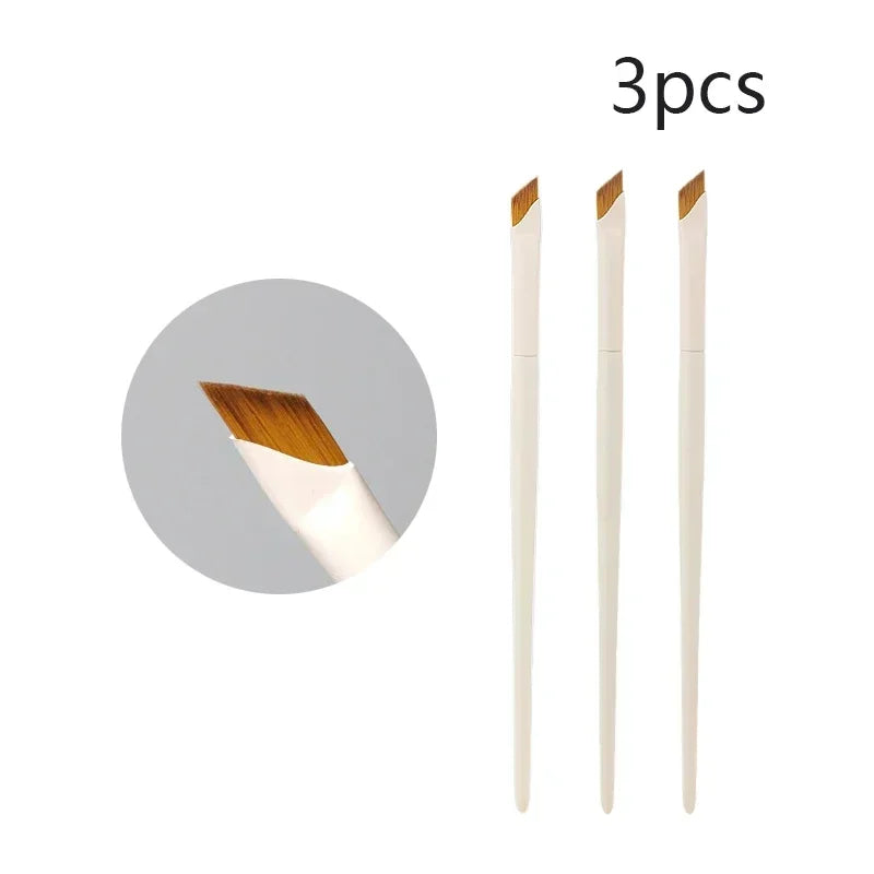 Three precision eyeliner application brushes shown standing upright.
