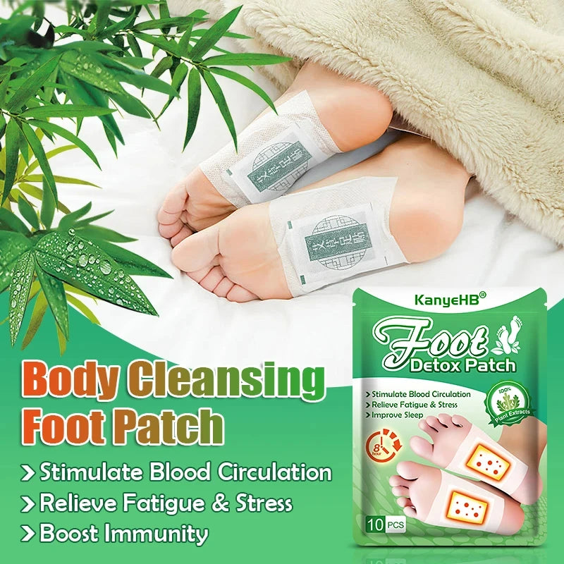 A pair of feet wearing green detox patches on a white surface next to a fluffy blanket.