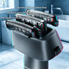 A close-up of a professional reciprocating electric shaver head with various trimming blades mounted on a dark gray device.