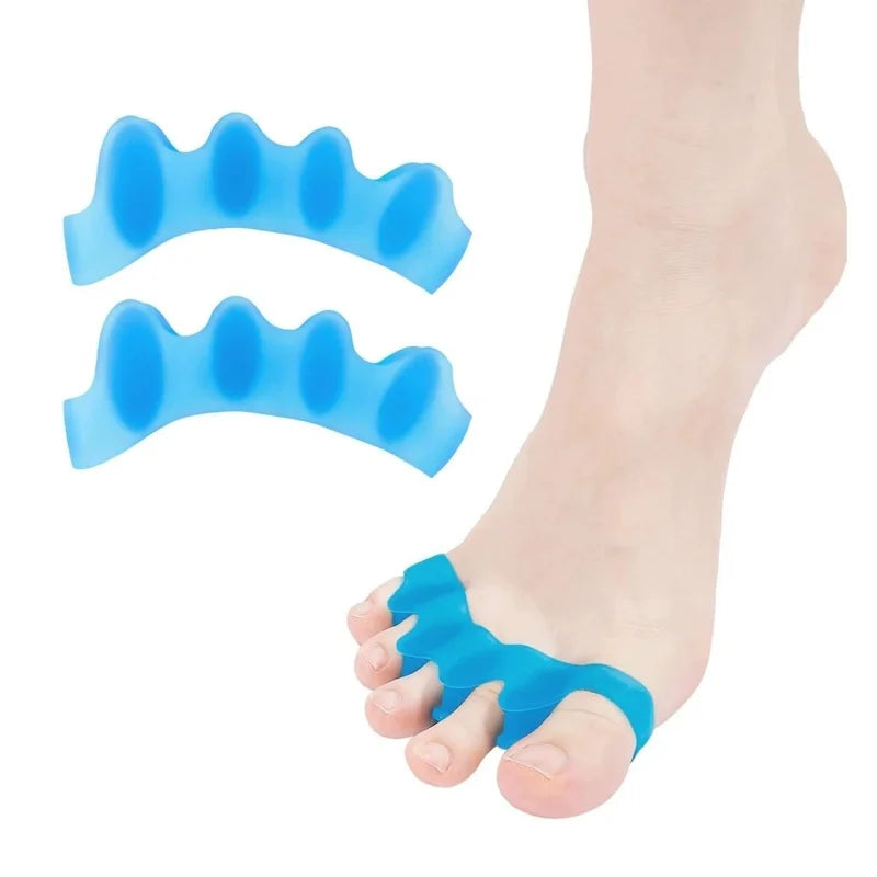 Blue silicone toe separators placed on a foot for foot and bunion relief.