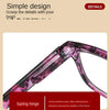 Close-up view of purple photochromic reading glasses with a spring hinge mechanism.