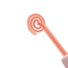 A close-up view of a pink high frequency facial electrotherapy wand with a coiled tip.