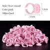 A pile of pink heart-round glue rings for eyelash extensions and nail art