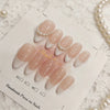 Pink handmade press-on nails with a sheer pink and white gradient finish displayed on a card.