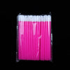A pack of pink disposable lip brushes with white nylon applicators inside a clear plastic wrapper.