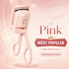 A pink electric heated eyelash curler tool shown against a soft pink background.