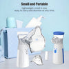A collection of small, portable handheld medical nebulizers and related accessories on a light blue surface.