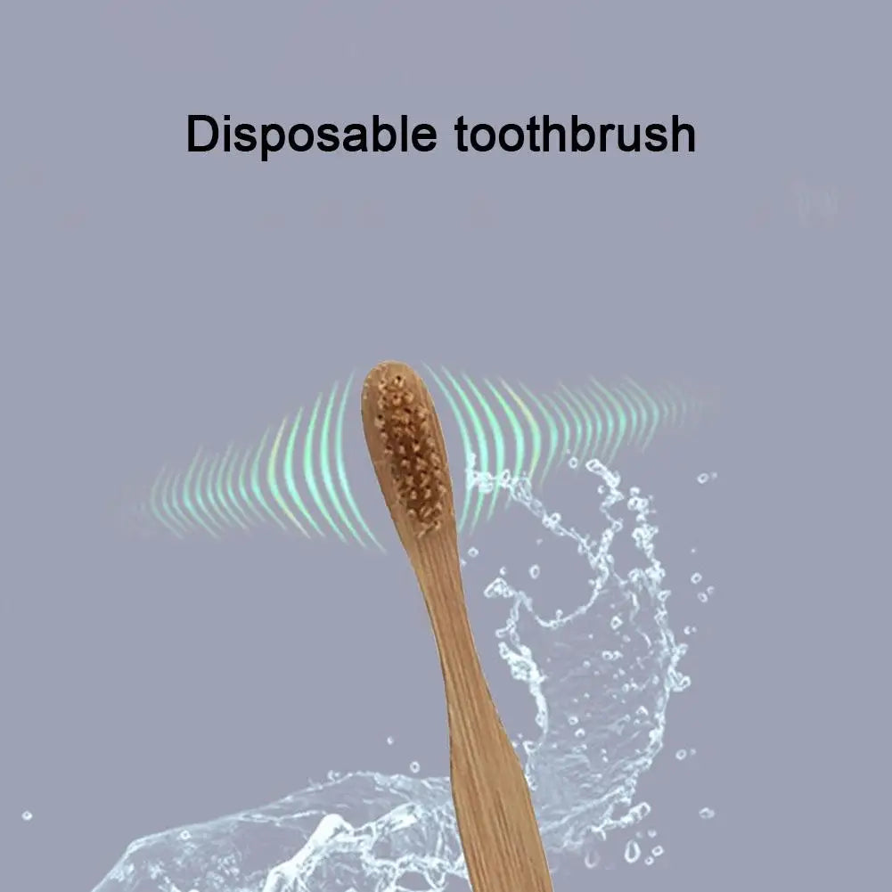 A wooden disposable bamboo toothbrush is shown immersed in water droplets.