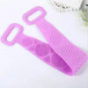 A pink silicone dual-sided body scrub and exfoliating brush with textured surfaces.