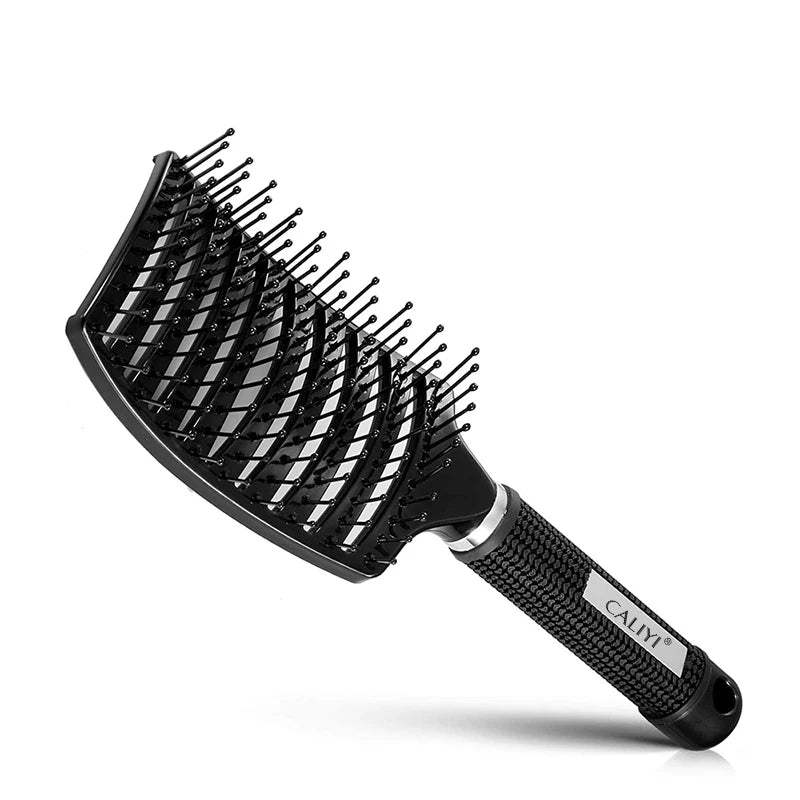 Black curved vented hair brush with a textured surface and a black handle