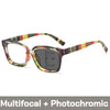 A pair of tortoiseshell photochromic reading glasses with a green and yellow striped frame.