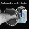 A clear, portable rechargeable mesh nebulizer device emitting a cloud of mist.