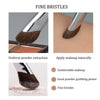 Close-up view of a fine bristle makeup brush demonstrating uniform powder extraction and natural application.