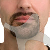 A close-up of a man's face showing a professional beard shaping tool being used to style his mustache and beard.