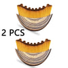 A pair of wooden face brushes with golden bristles and marbled wood handles for lymphatic drainage.
