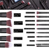 A collection of professional makeup brushes in various shapes and sizes including blending, concealer, highlight, detail, and