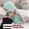 A pair of pink-framed reading glasses with gold accents are held over a light blue case.