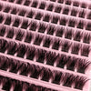 A close-up view of a kit containing clusters of black eyelash extensions.