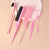 A pink hair styling tool kit featuring a rat tail comb, edge brush, and pair of pink scissors on a white plate.