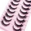 Un plateau en plastique rose contenant plusieurs paires de faux cils de renard noirs.