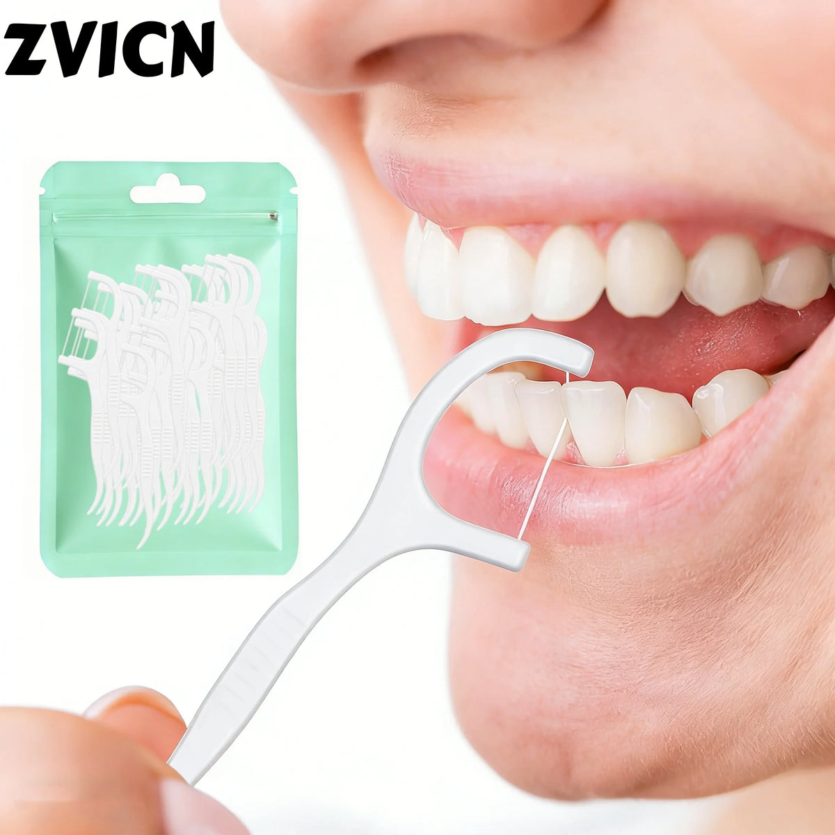 A hand holds a white dental floss pick against a person's mouth, with a green pouch of the same picks visible.